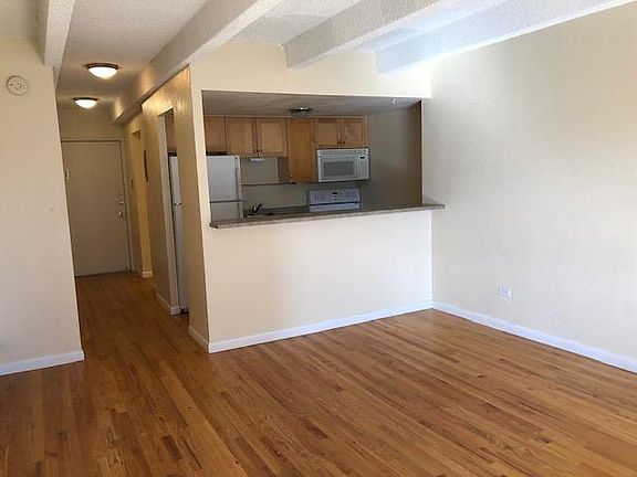 Kitchen with pass through to living space.