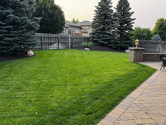 mature trees and manicured lawn