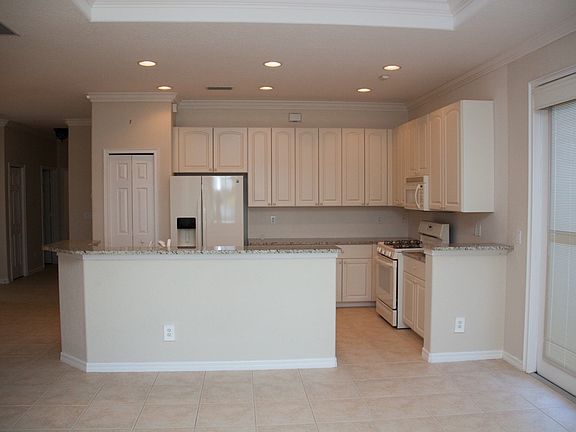 View from living room into kitchen. Service door on right.