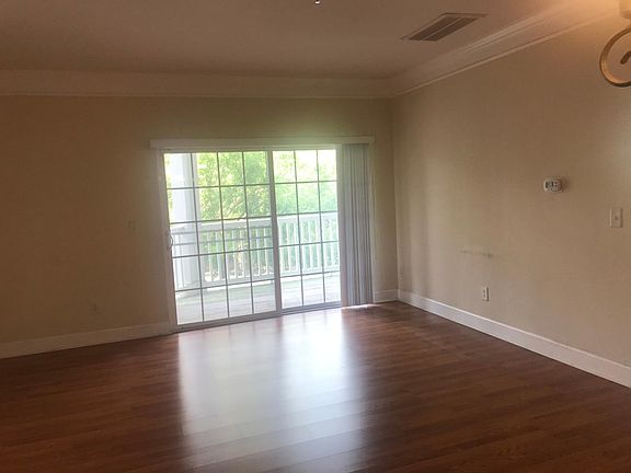 Living room opens to balcony