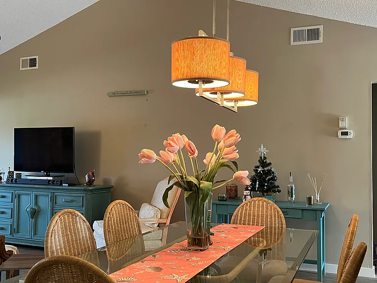 Dining room with vaulted ceiling and open floor plan.