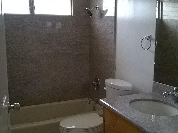hallway bathroom, granite shower and vanity top