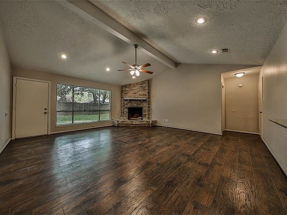 Look at these floors. Pretty fireplace. High ceilings.