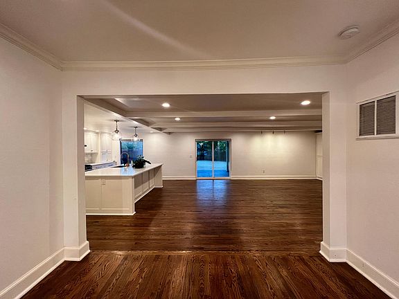 Formal dining opening to the Den/TV and kitchen