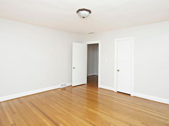 This is still the bedroom. The closed door is a closet and the open door goes back into the foyer. I really like the foyer because it separates the private rooms from the public rooms. The foyer is also a great place for a bookcase, a terrific piece of