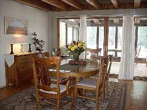 Dining room that opens to sunroom