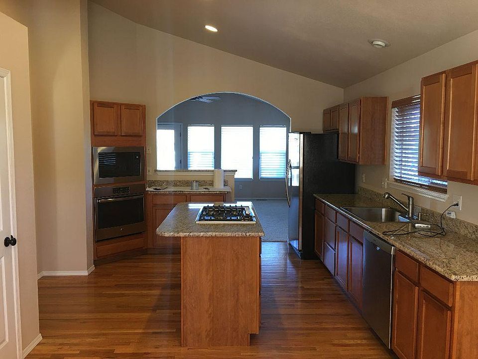 Large Kitchen with gas cooktop and granite countertops. New 