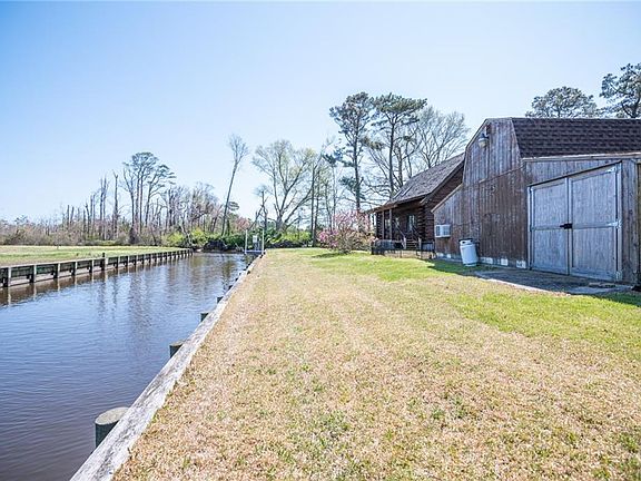 Large detached barn/ garage with heat and cool, a large utility sink, bathroom and plenty of storage or room to work on your vehicles. 