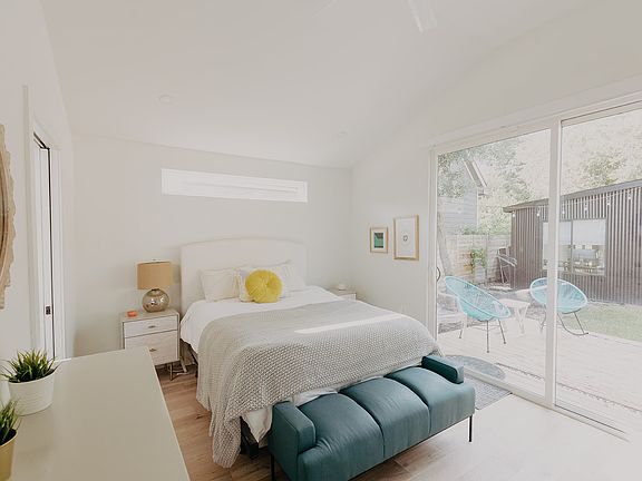 master bedroom facing yard with sliding door. includes en-suite bathroom and two large closets.