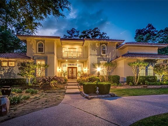 If your lifestyle dream is golf course living in a beautiful natural setting with unparalleled privacy, you have found "home". This home & grounds are protected 24/7 by 5 exterior & interior surveillance cameras. Large circular drive and spacious garage e