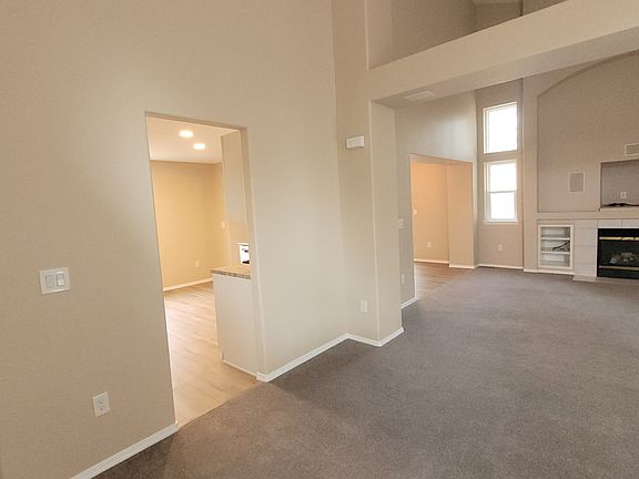 Entryway looking onto greatroom, kitchen, and dining room