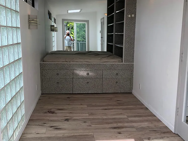 Office/den which can also be used as a bedroom. Built-in storage and small bed.