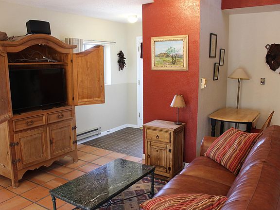 Smart TV provided, and leather sofa for great movie watching