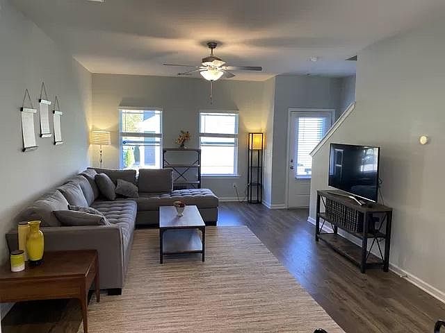 Spacious living room with wood flooring
