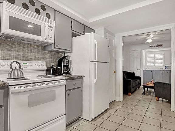 kitchen and den with in-unit washer/dryer