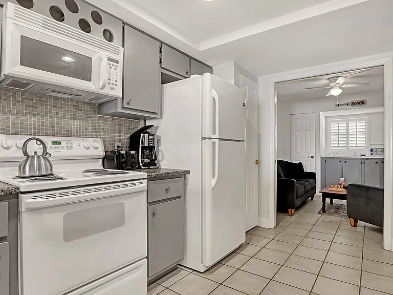 kitchen and den with in-unit washer/dryer