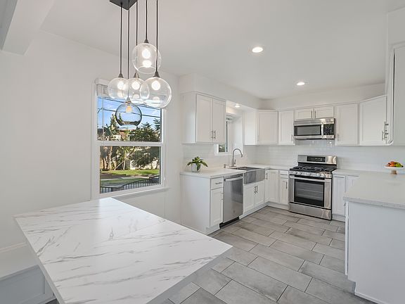 Remodeled kitchen with architectural lighting.