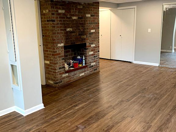 Capped fireplace in main living area. Washer/dryer behind closet doors.