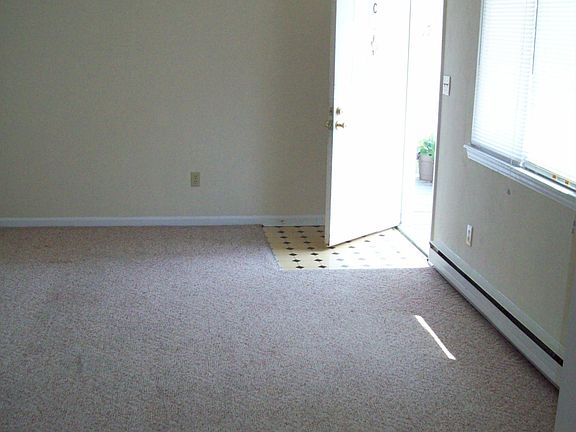 Living Room with decorator ceiling and lots of light.