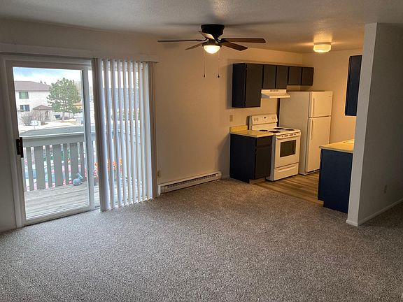 As you enter the apartment through the living room you have sunlight and fresh air from the patio and the kitchen is on the right.