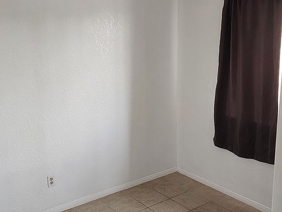 first bedroom with closet off hallway
