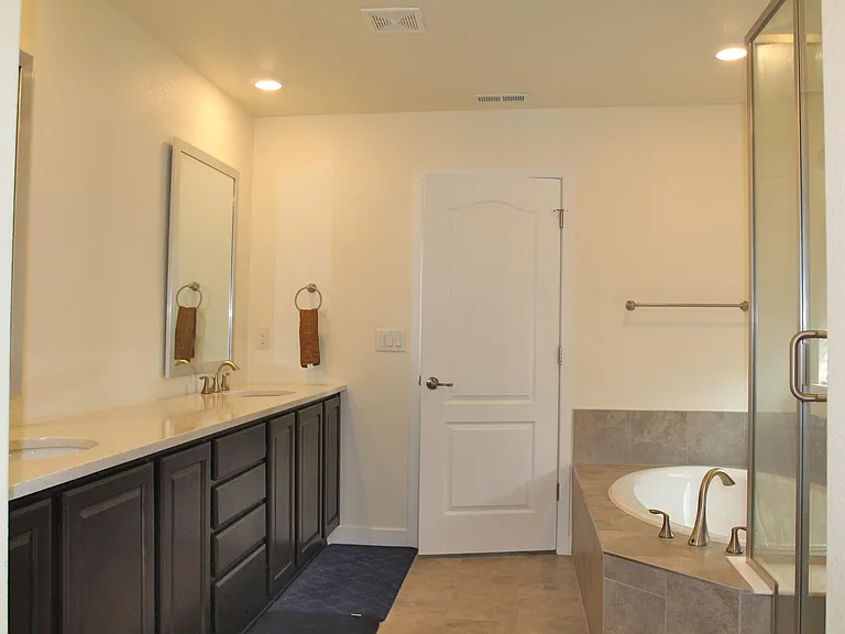 Amazing primary bath with soaking tub and miles of vanity!