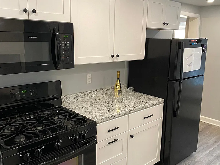 Kitchen where people can hang out and have a toast