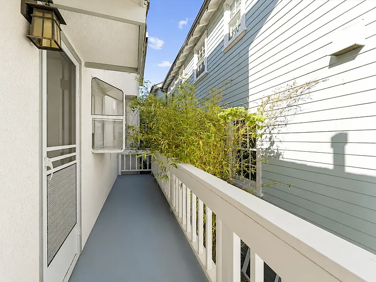 Unit A private deck by kitchen