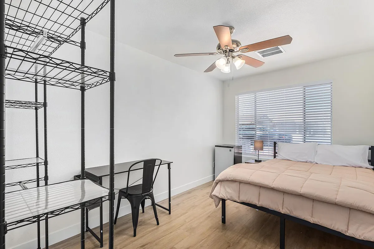 Full size bedroom includes, desk, chair, lamp and wardrobe fixture. - N 51st Dr