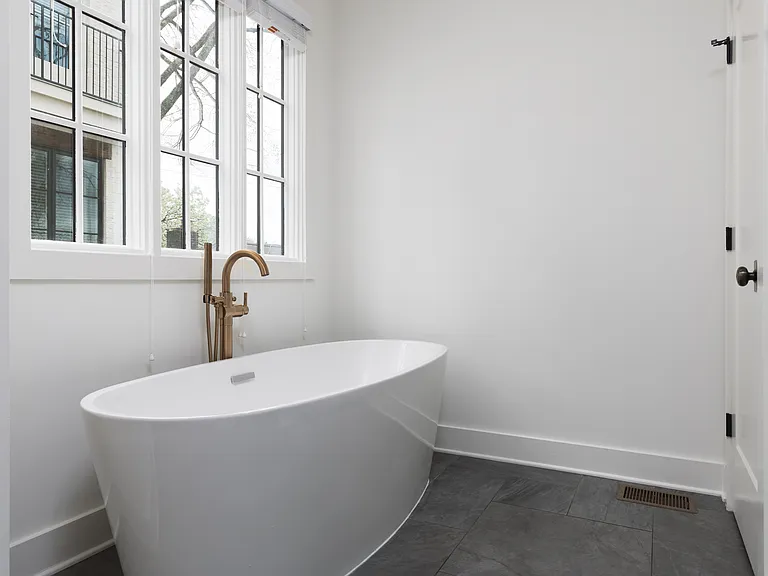 Full Bathroom connected to bedroom 1 with double vanity, shower, and large bathtub.