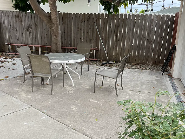 Shared Mid Entrance Yard/ Patio next to garages and front door