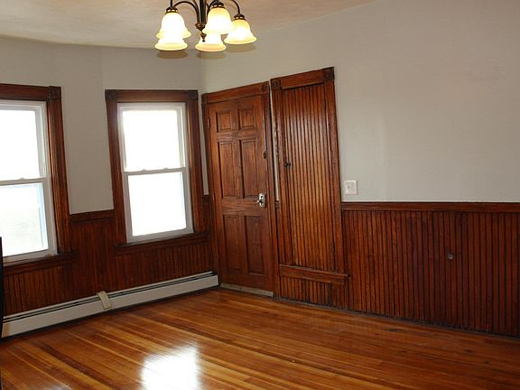 Beautiful natural wainscoting in dining room.
