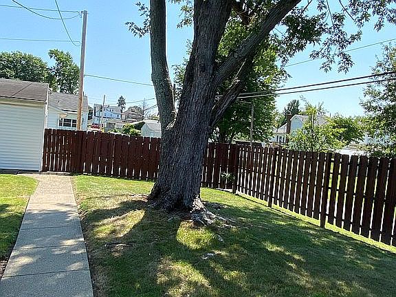 Fenced corner lot backyard