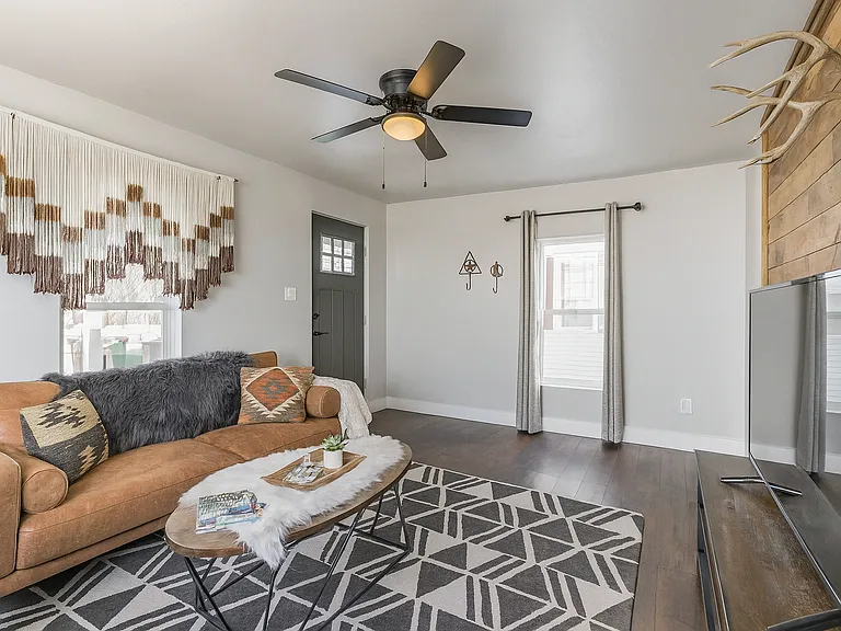 Unwind in this inviting living room that blends modern boho style with rustic charm