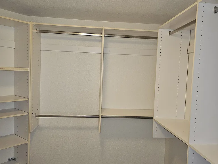 Ample shelving and hanging space defines this highly functional closet.