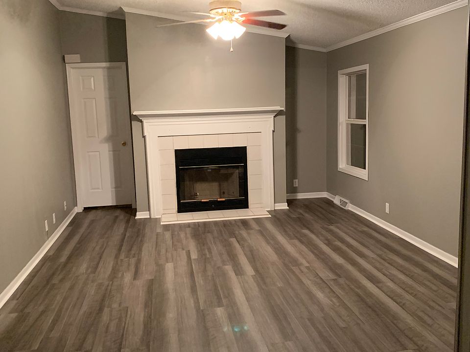 Den with gas fireplace.