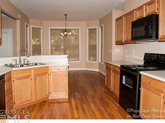 Cheery kitchen with warm wood floors