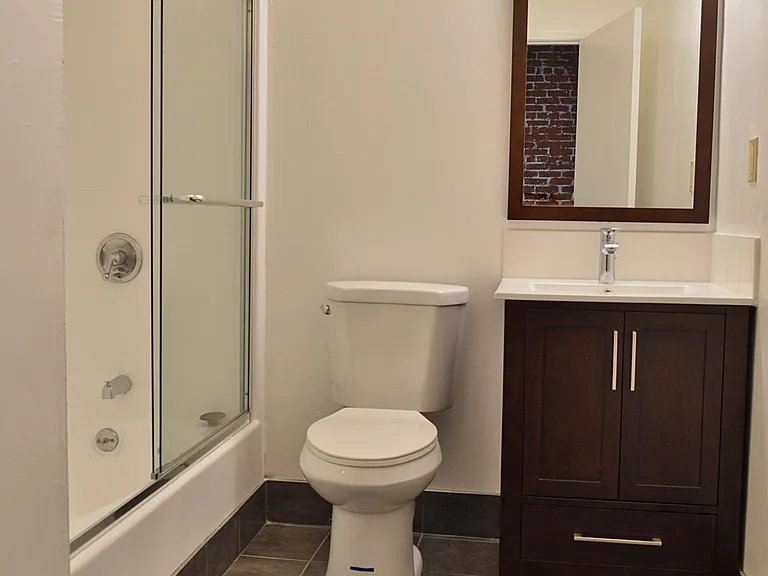 All bathrooms come with tile flooring, large bathtub/shower combo with glass doors, and a full vanity.