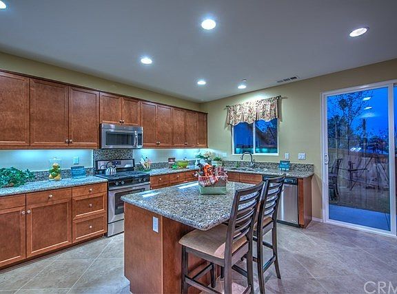 Photo of model home kitchen, photo not intended to depict actual home