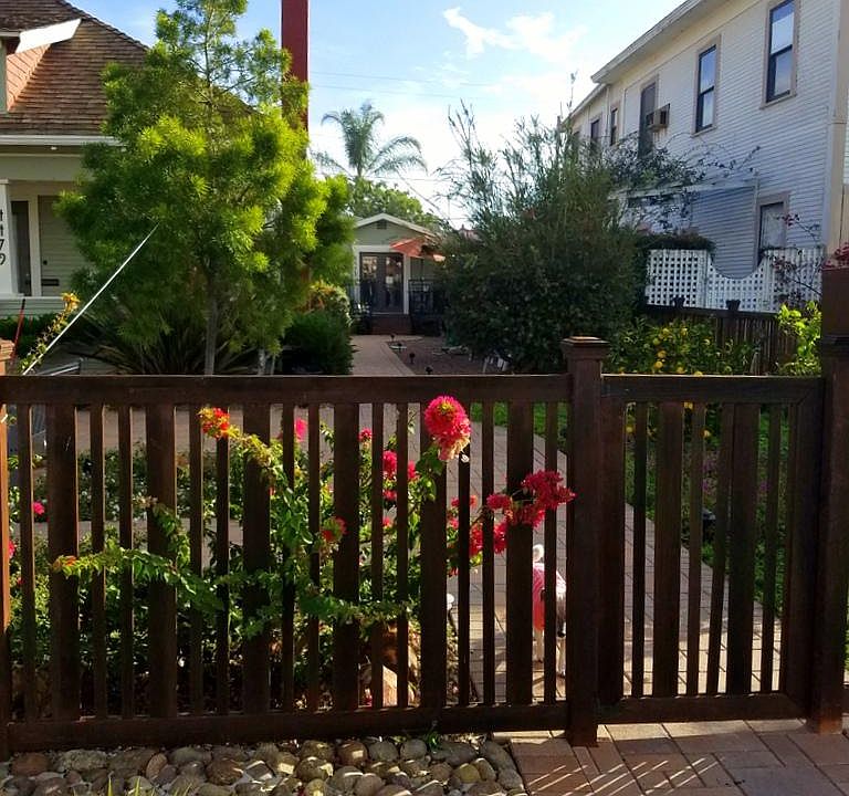 Front gate for 4475 Cleveland Ave and looking down path to the front door