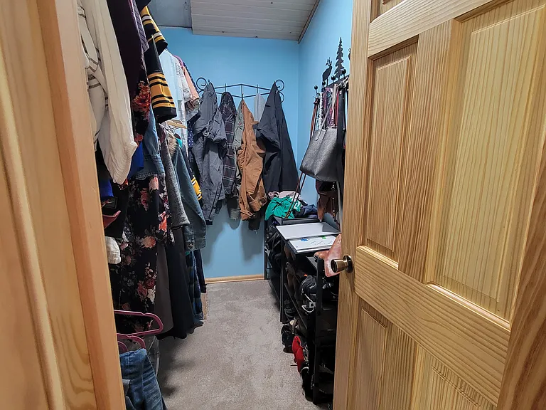 Upstairs primary bedroom walk-in closet