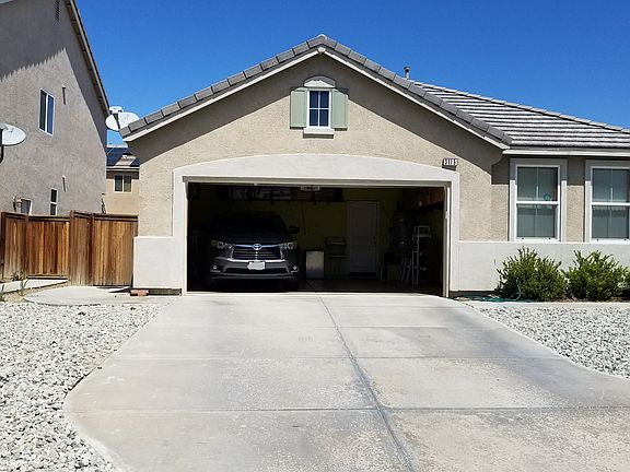 Fits 2 cars inside the garage.