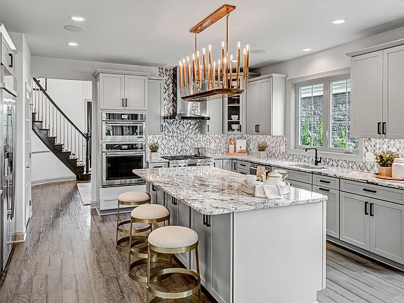Gorgeous open kitchen with large center island and endless cabinet space