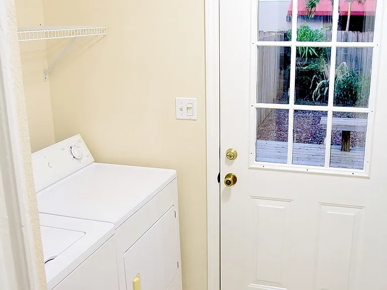 Full Size Washer/Dryer With Overhead Shelf.