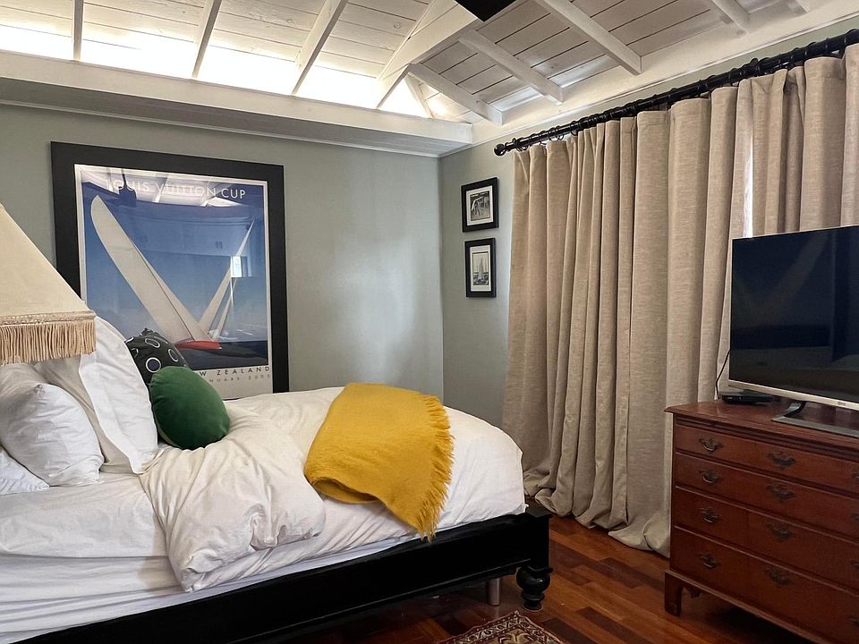 Master Bedroom with open beam ceiling and ceiling fan