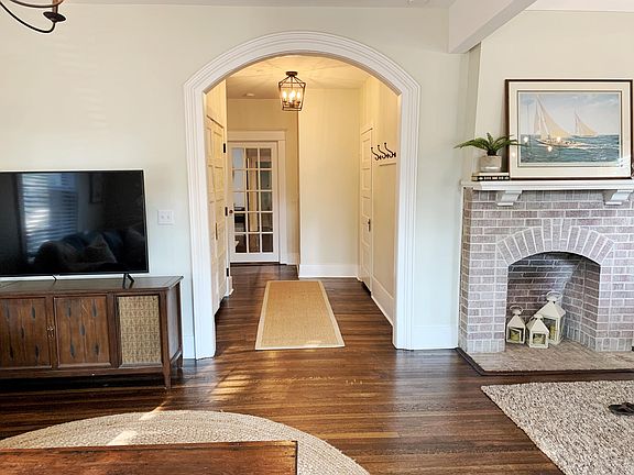 Front living space and hallway with 7' storage closet