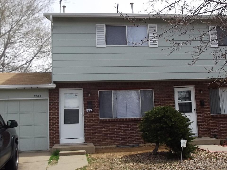 Front of home shows the attached garage.