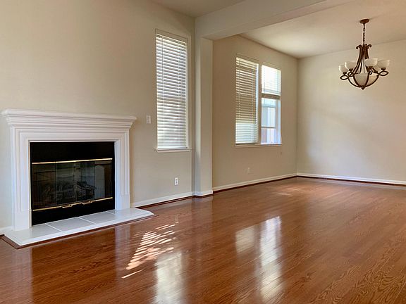 Step through the front door into a spacious family space complete with fireplace.
