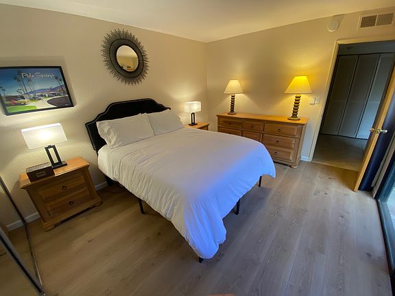 Guest bedroom with sliding glass door views to the private front courtyard. (right side of picture)