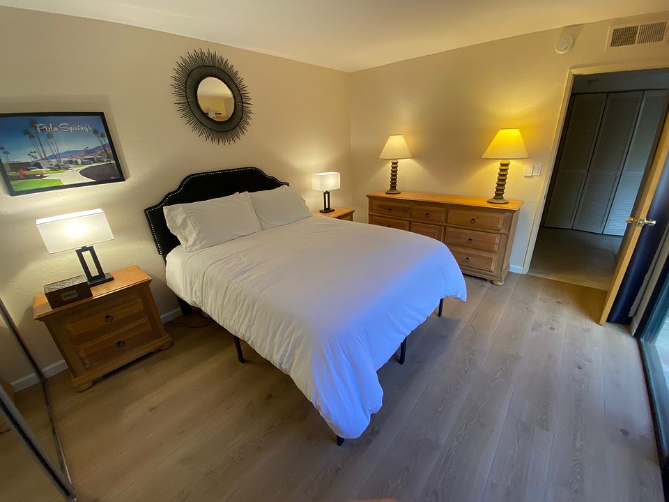 Guest bedroom with sliding glass door views to the private front courtyard. (right side of picture)